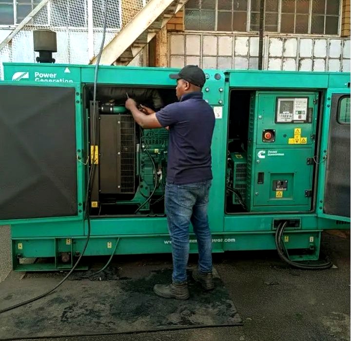 PowerFix engineer carrying out on-site diesel generator repair in Ogun State